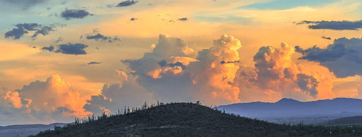 Clouds Sunset from San Xavier del Bac Mission, a fine art photograph by Janell Evelyn Baca