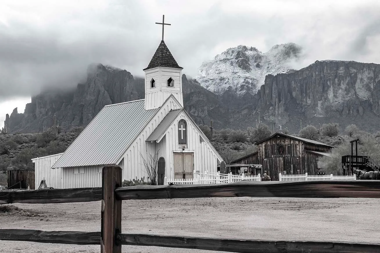 Cloudy Snowy Elvis Chapel at the Superstition Mountains, a fine art photograph by Janell Evelyn Baca