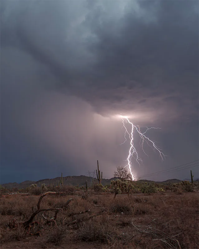 Lightning in the Hills Hwy 60 near Peralta, a fine art photograph by Janell Evelyn Baca