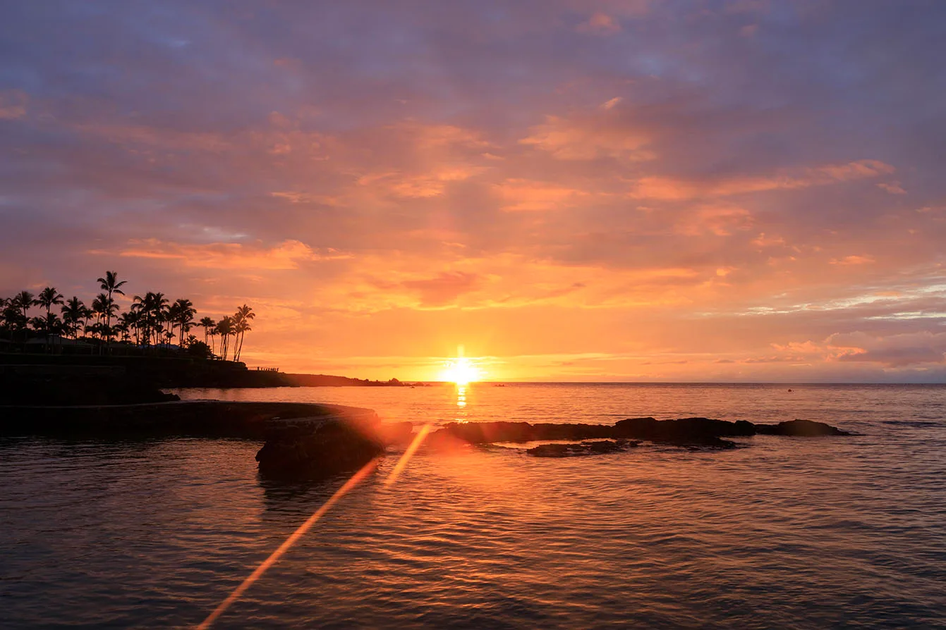 Sunset at Makaiwa Bay, ocean and lake and river and pier, a fine art photograph by Janell Evelyn Baca
