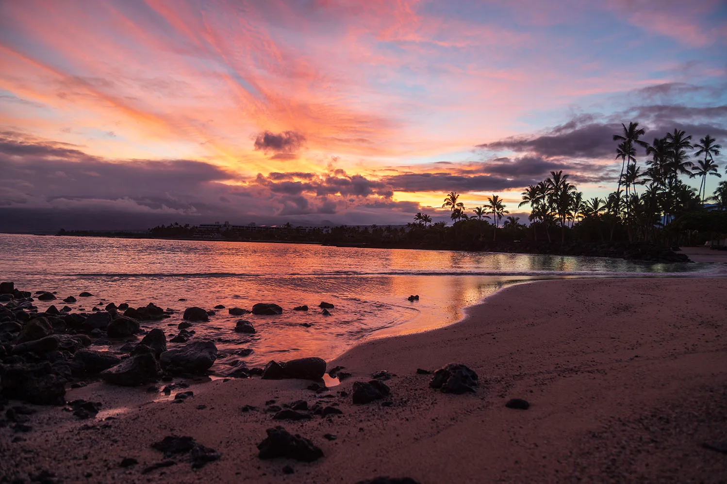 Sunset Reflections at Makaiwa Bay, ocean and lake and river and pier, a fine art photograph by Janell Evelyn Baca