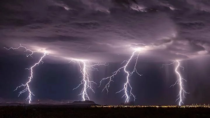 The Electric Chair Eyman Complex Florence AZ, lightning, a fine art photograph by Janell Evelyn Baca
