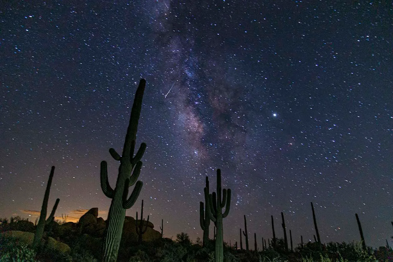 To Catch a Falling Star at The Boulders Milky Way, a fine art photograph by Janell Evelyn Baca